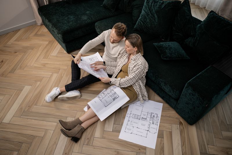 a couple looking at their home remodeling plan