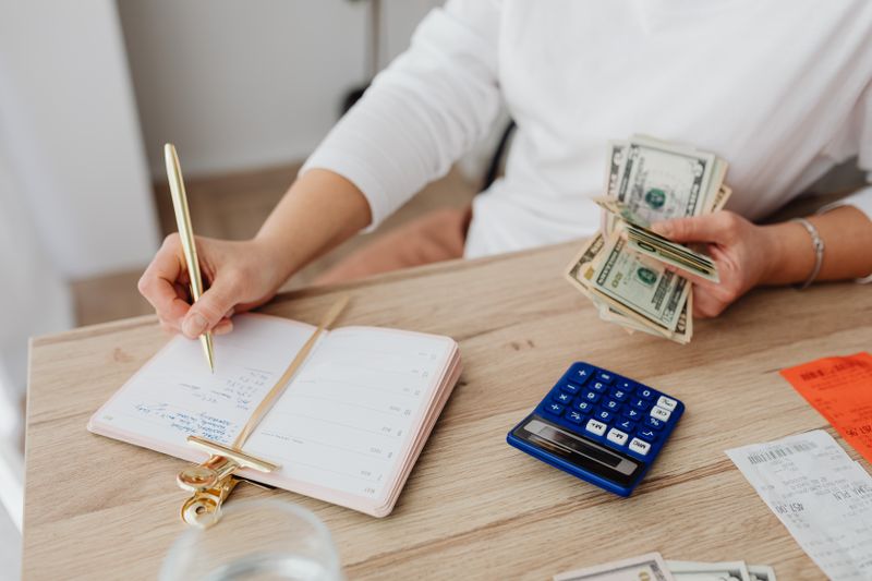 a woman budgeting her money